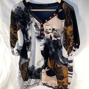 St-Martins casual blouse with beautiful black and cream pattern, orange buttons